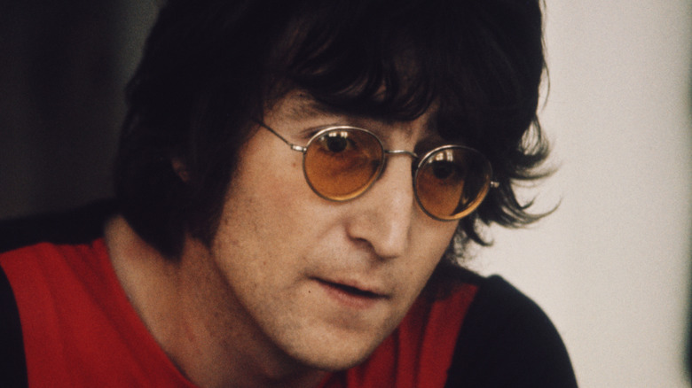 John Lennon leaning forward talking
