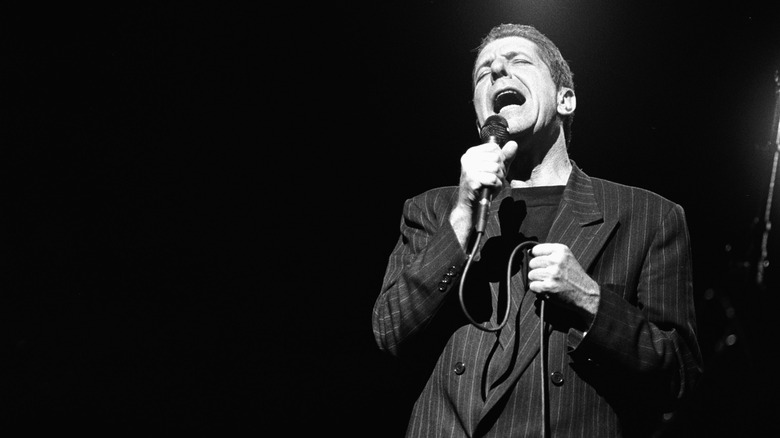 Leonard Cohen singing on stage