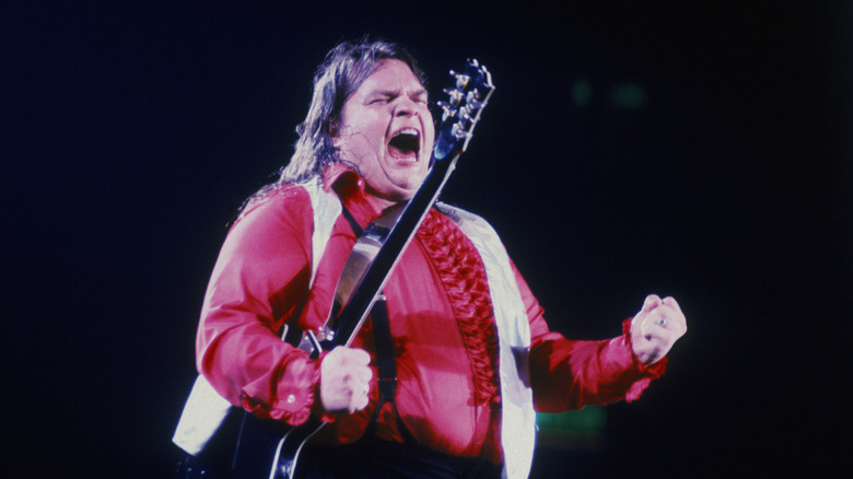 Meat Loaf singing with eyes closed and fists balled