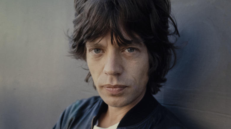 Black and white photo of Mick Jagger performing with the Rolling Stones during a 1967 concert in Boston