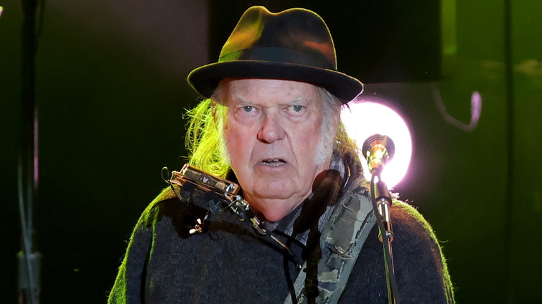 Neil Young onstage staring into crowd