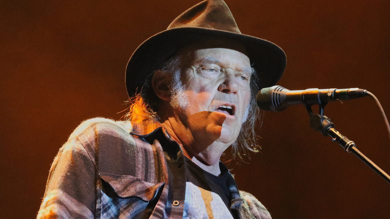 Neil Young singing onstage