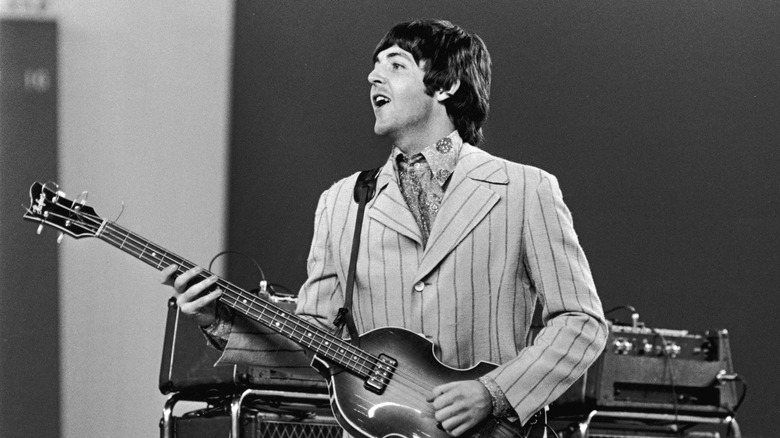 Young Paul McCartney performing on stage