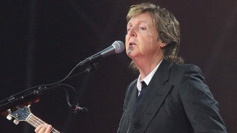 Paul McCartney playing bass and singing
