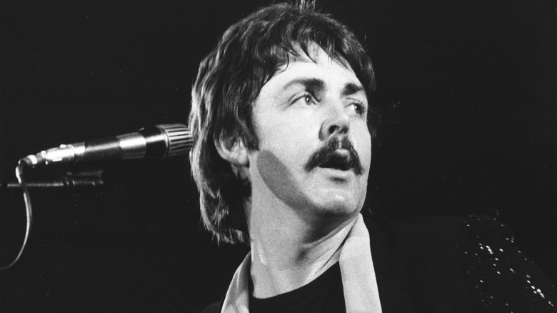 Paul McCartney on stage by mic