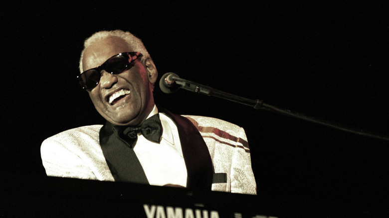 Ray Charles in white tuxedo at piano