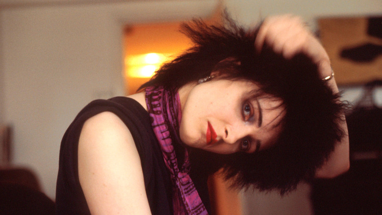 Siouxsie Sioux posing with head bowed