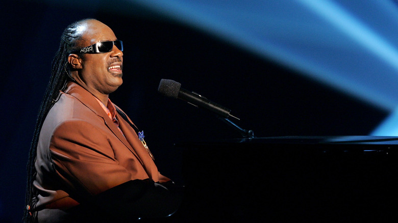 Stevie Wonder playing piano on stage