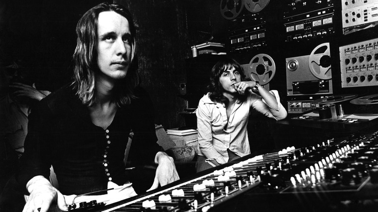 Black and white photo of Todd Rundgren alongside an unnamed coworker at a studio mixing desk in 1974 in New York