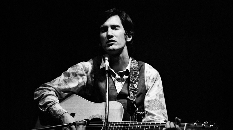 Townes Van Zandt singing and playing guitar