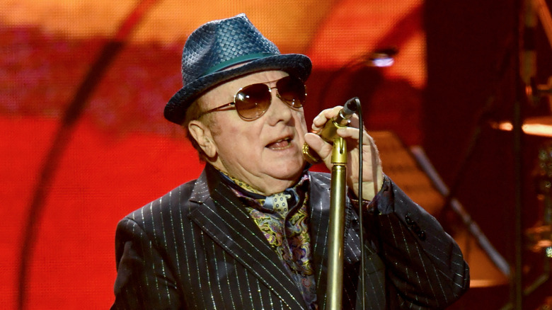 Van Morrison in sunglasses at microphone