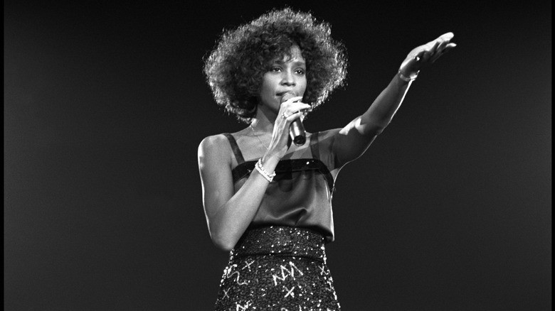 Whitney Houston onstage with microphone