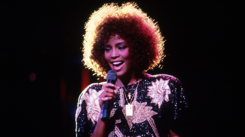 Whitney Houston onstage with microphone
