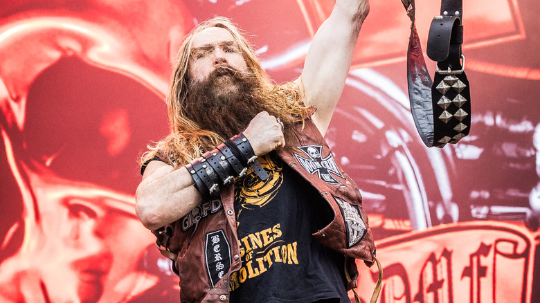 Zakk Wylde holding his guitar up for the audience