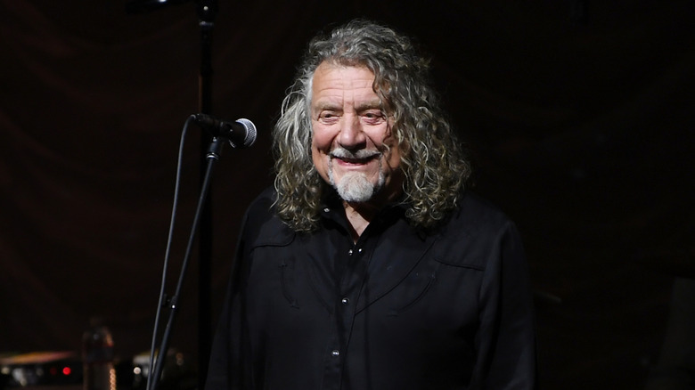 Robert Plant smiling onstage