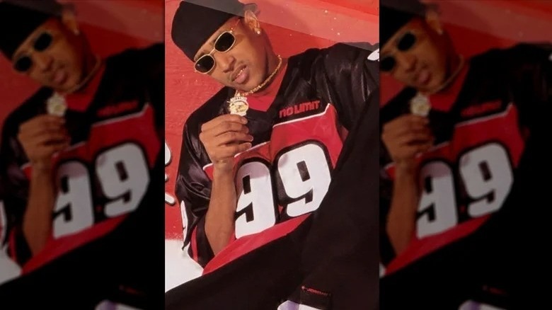 C-Murder holding up a gold medallion