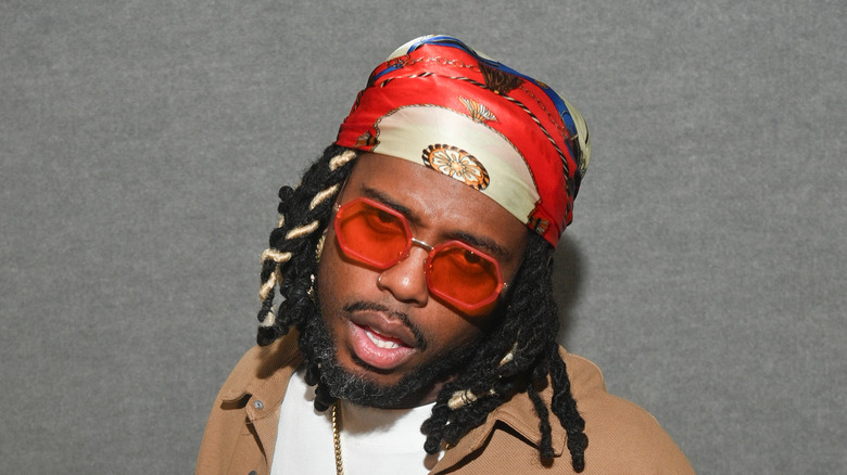 B.o.B. wearing red sunglasses 