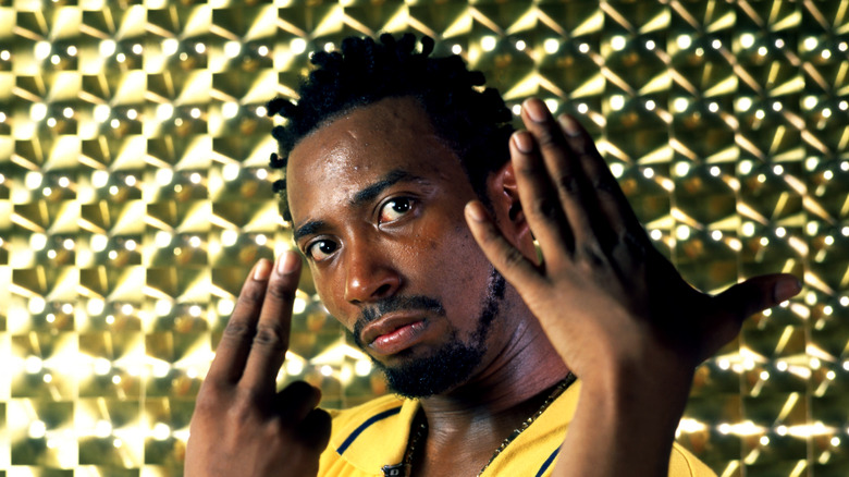 ODB yellow shirt hands raised