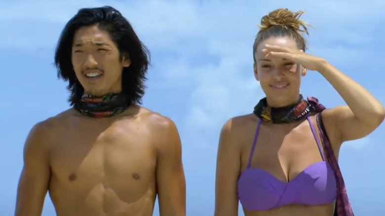 Survivor contestants squinting as they look at challenge