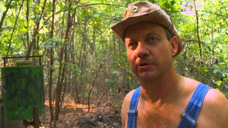 Moonshiner speaking to camera