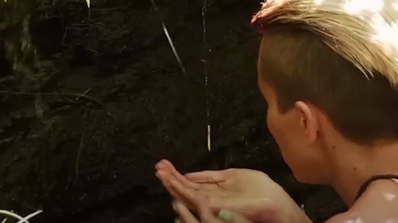 Phaedra Brothers shown drinking from a stream