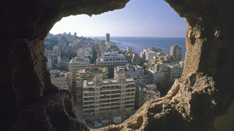 View of Beirut through damaged masonry