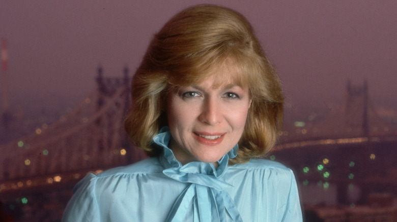 Jessica Savitch in publicity photo in front of city scene