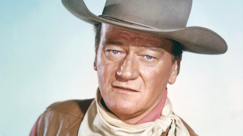 studio portrait of John Wayne cowboy hat 