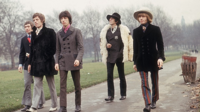 Brian Jones jacket walking in park with Rolling Stones