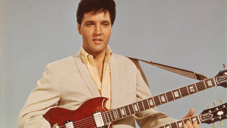 Elvis Presley red guitar white suit playing