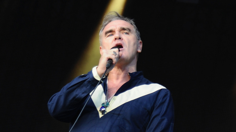Morrissey singing mic blue white shirt