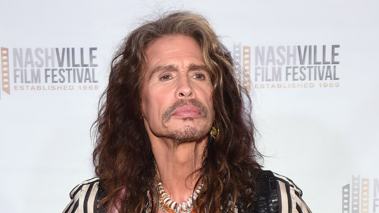 Steven Tyler long hair event pouting