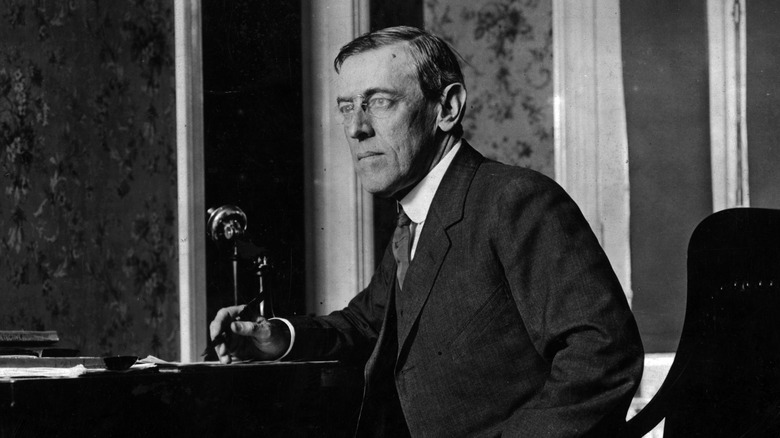 woodrow wilson sitting at desk