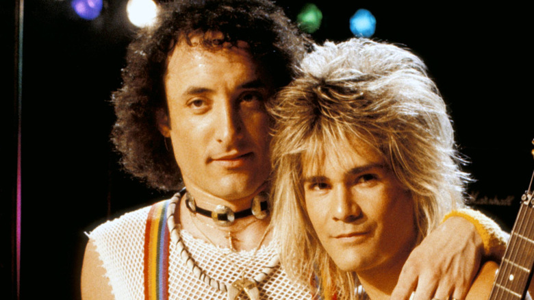 Kevin DuBrow and Carlos Cavazo of Quiet Riot embracing