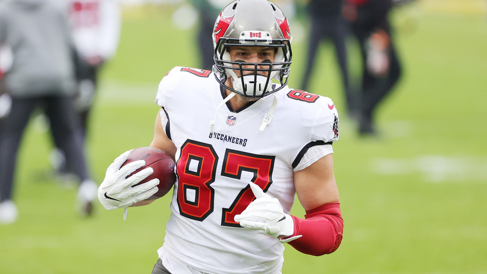 Rob Gronkowski running a football