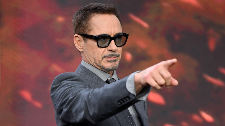 Robert Downey Jr. pointing wearing tinted glasses