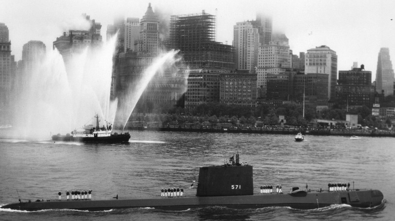USS NAUTILUS entering New York harbor on 25 August 1958, after her voyage under the North Pole.