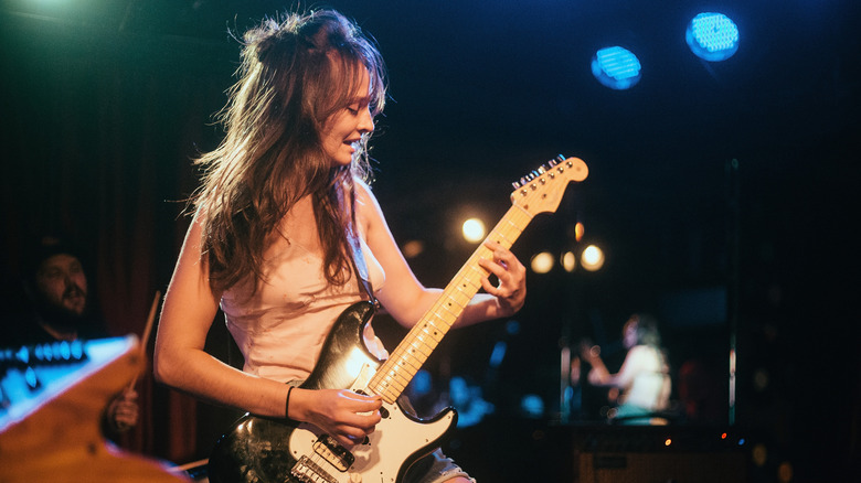 Clementine Creevy of Cherry Glazerr playing her guitar on stage in 2017