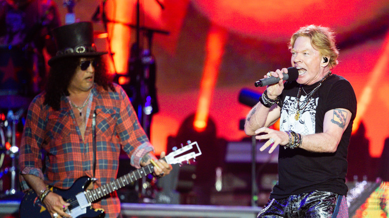 Axl Rose and Slash performing on stage
