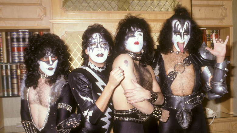 KISS posing in a library in 1982