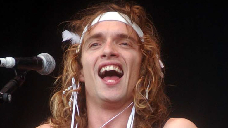 Justin Hawkins smiling onstage