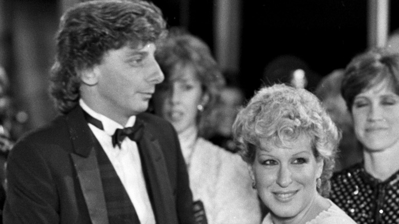 Barry Manilow looking past Bette Midler