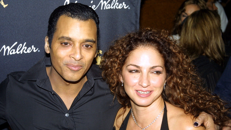 Jon Secada with arm around Gloria Estefan