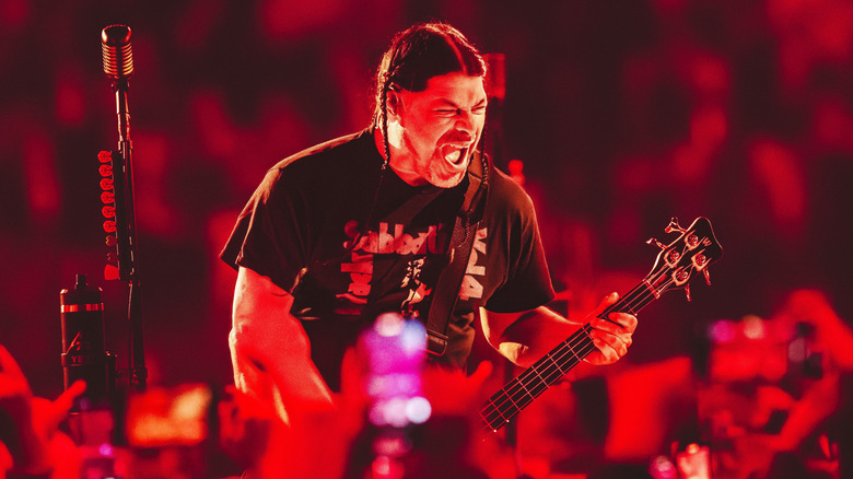 Robert Trujillo of Metallica playing bass on stage.