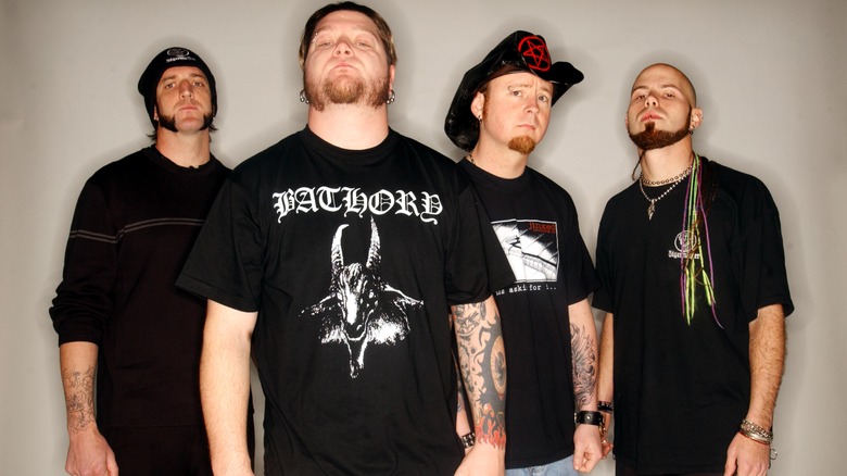 Drowning Pool posing for a press photo in 2001