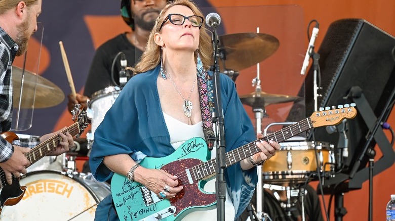 Susan Tedeschi playing guitar onstage 2023