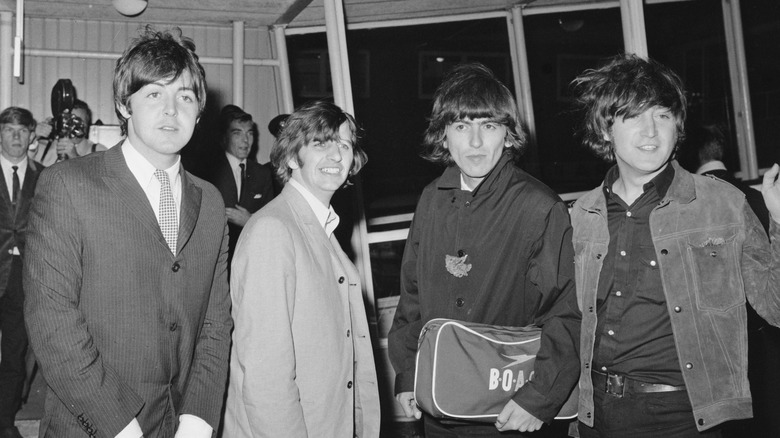 beatles returning to london from performances in the united states, 1965