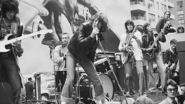 the rolling stones performing on a flatbed truck in new york in 1975