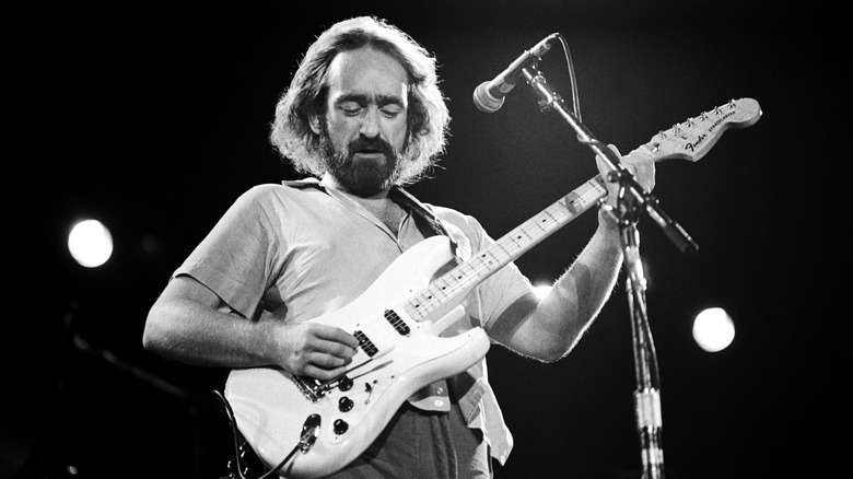 Dave Mason with guitar onstage in 1980