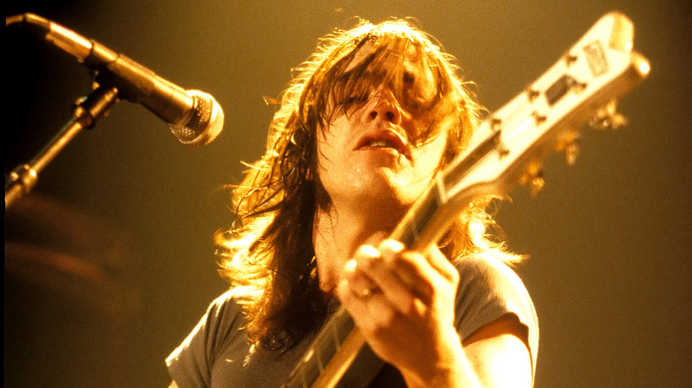 Malcolm Young onstage with guitar